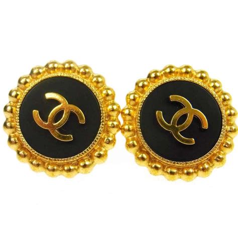 black and gold vintage chanel earrings|More.